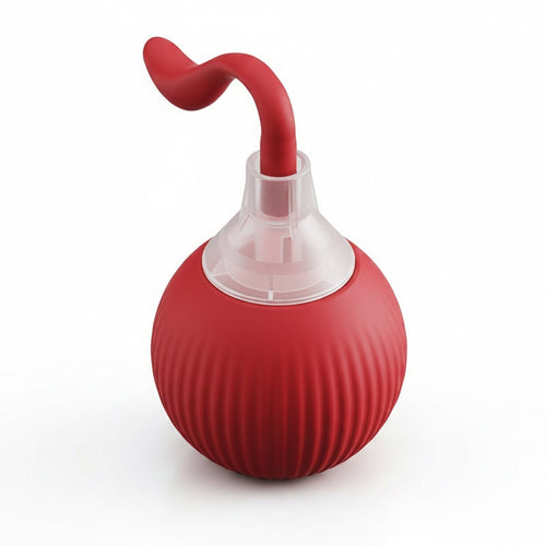 Red bulb syringe with a clear chamber on a white background